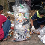 FMIPA UNNES academic community members sorting plastic and other waste on campus.