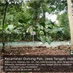 Green outdoor area with a WWTP sign at FMIPA UNNES.