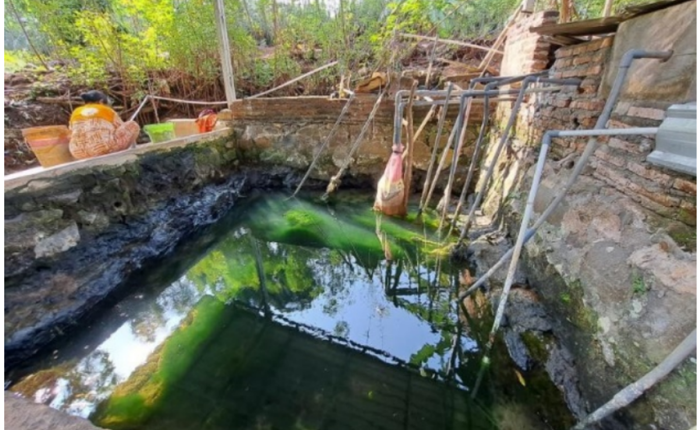 A spring with a water storage pond and piping system near the UNNES Gunungpati Campus.