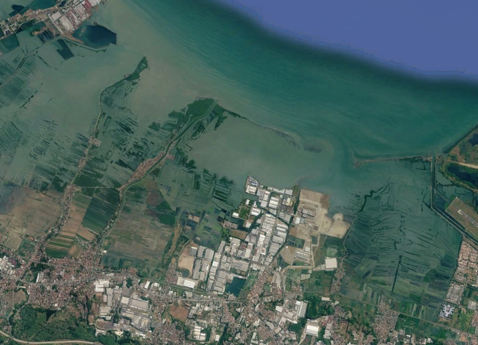 Satellite imagery of a coastal area showing blue-green ocean waters, the coastline boundary, and a landmass dominated by aquaculture ponds, settlements, and industrial zones.