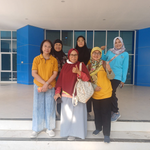 Six female professors and lecturers from the Biology Study Program at FMIPA UNNES standing together for a photo while smiling and giving a thumbs-up in front of a building with blue pillars.